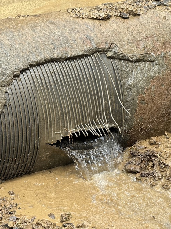Water spilling out of a ruptured 24-inch water main 