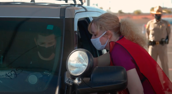 Dr. Cara Christ administering COVID-19 Vaccine to an Arizona DPS Trooper