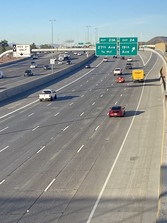 Photo of eastbound Loop 101 Pima Freeway with new lane addition.