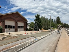 Crews work earlier in August to finish sidewalk repairs as part of drainage upgrades along US 180 (ADOT file photo)