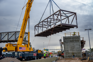 Crane lifting a truss