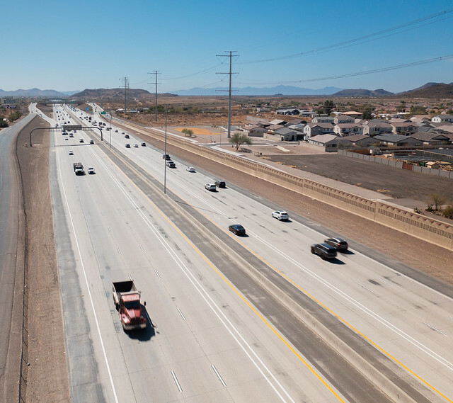 Cars drive on the newly completed I-17 Happy Valley Road to SR 74 Pavement Project.