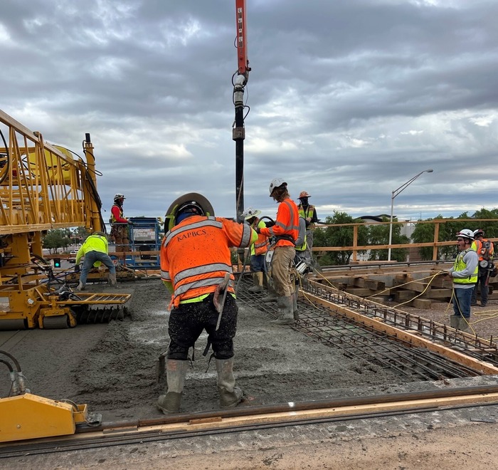 pouring and leveling the concrete bridge deck at the Loop 202 Arizona Avenue