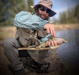 man with arctic grayling