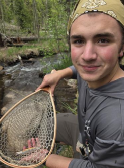 Owen Strogen teaching kids to fish