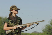 young woman hunting dove in yuma with shot gun