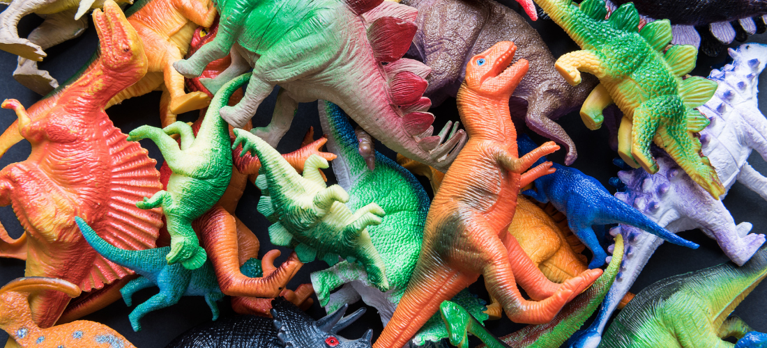 A variety of colorful plastic dinosaurs
