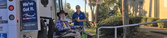 two people by a bus