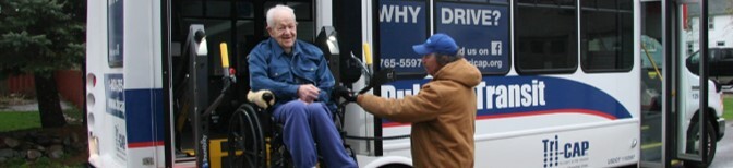 man in wheelchair on bus lift