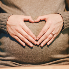 Pregnant Woman hands on belly 