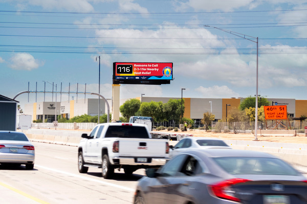 Heat relief billboard that includes a temperature gauge graphic and messaging that reads 116 reasons to call 2-1-1 for heat relief