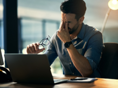 man stressed at desk