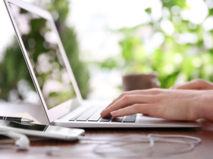 person typing on laptop - for workday update