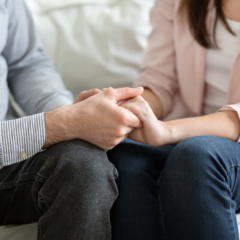 couple supporting and holding hands