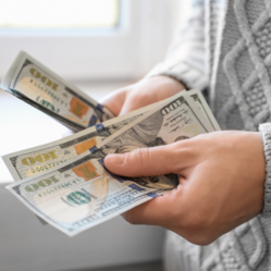 person counting money - square image