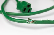 Frayed green electrical cord