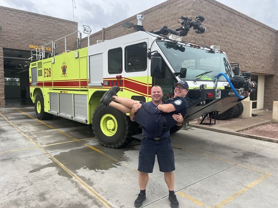 208 AARF truck at station with posing fire fighters