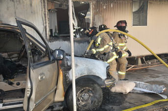 Vehicle fire at mobile home