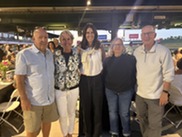 Group of 5 people standing at Sloan Park