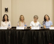 4 women sitting at panel