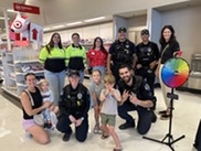 Policemen, Target workers, Councilmember at store, standing and smiling