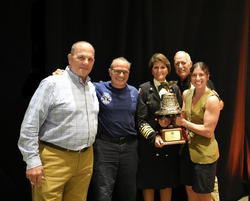 Cameli receiving award with family