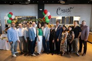 balloons and a large group standing at Crust Simply Italian