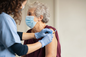 giving covid vaccine