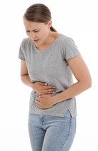 Woman displaying signs of an upset stomach