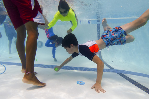 kids swimming under water