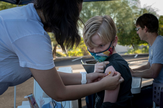 Child getting COVID-19 vaccination