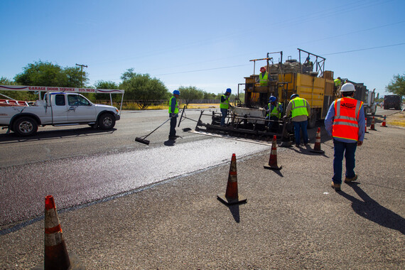 Department of Transportation crews repairing a road