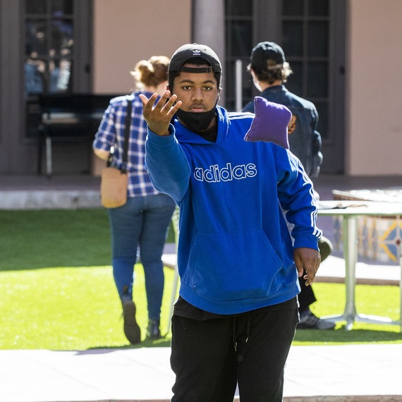 A man playing cornhole