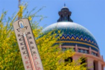A thermometer in front of the courthouse
