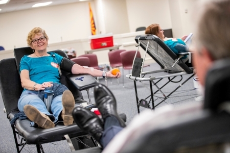 A County employee donating blood