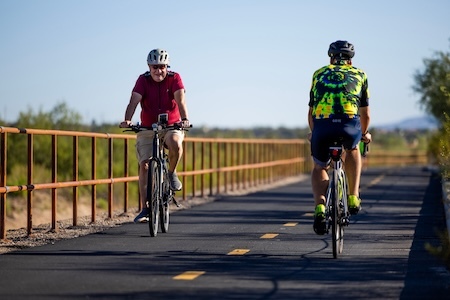 Men cycling on The Loop