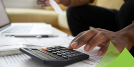 Hand using a calculator