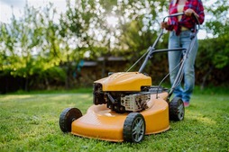woman using a lawn mower