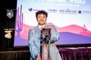 Photo of a kid holding a trophy
