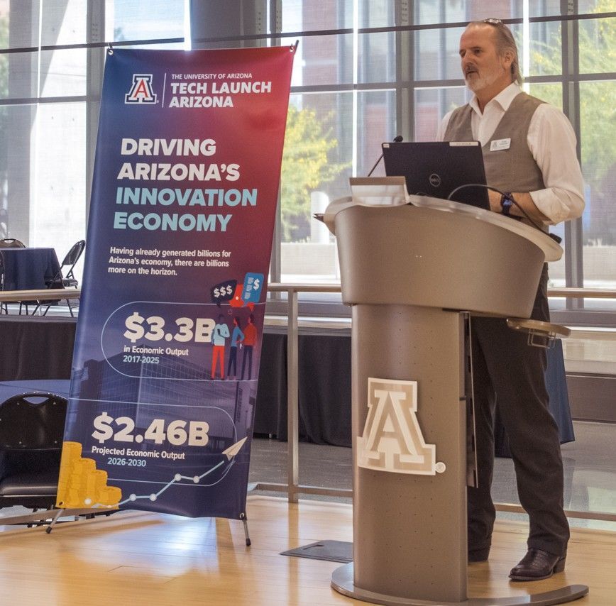 Doug Hockstad from TechLaunch AZ is speaking at a podium