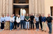 A group stands in front of the Pima County Courthhouse