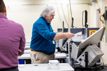 Man using voting machine