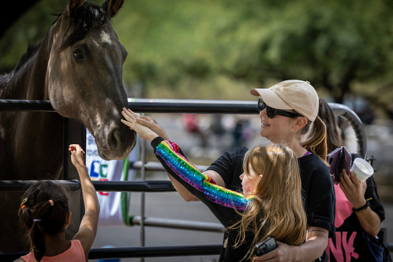 Girl petting horse at Brandi Fenton Park