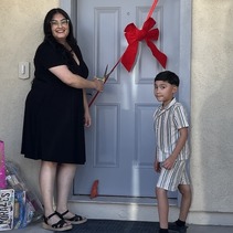 Mom and young son outside door