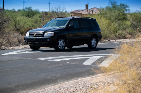 Car driving over speed bump