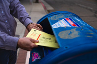 putting ballot in mailbox