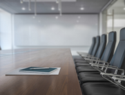table and chairs with a tablet on the table for notes