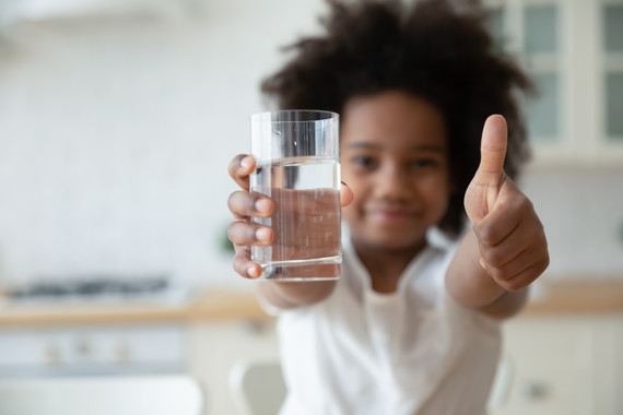 happy child with glass of water