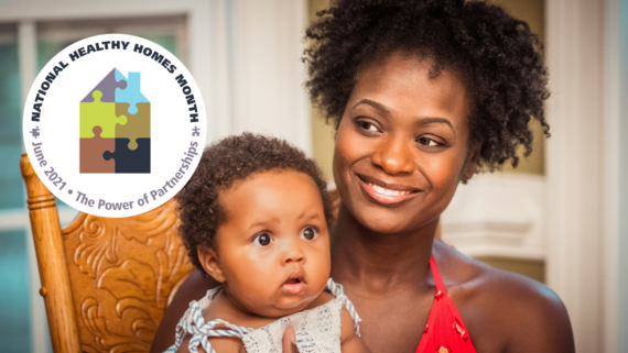 Image of a woman holding her child with the National Healthy Months Month logo