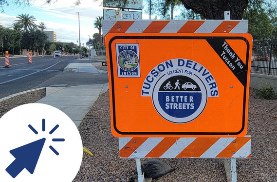 Orange Tucson Delivers construction sign
